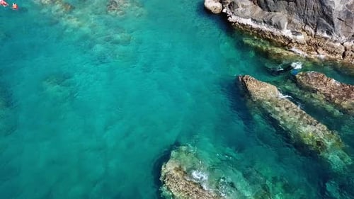Aerial View of Turquoise wWaves Hitting Coral Reefs, Stones.