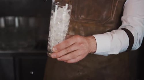 Bartender Prepares Drink with Ice