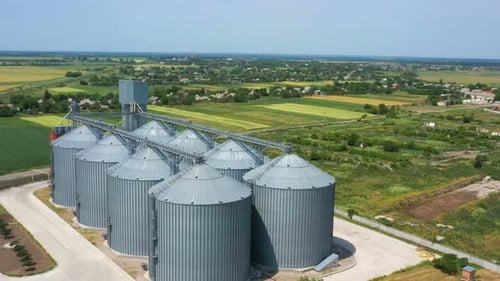 Modern Grain Silos At The Field Of Golden Wheat 2