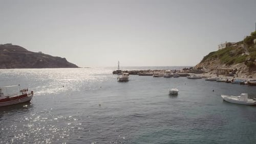 Aerial view of fishing boats anchored on the seashore in Greece.