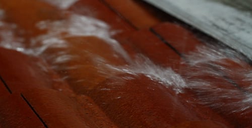 Water Flows Across Ridged Orange Surface
