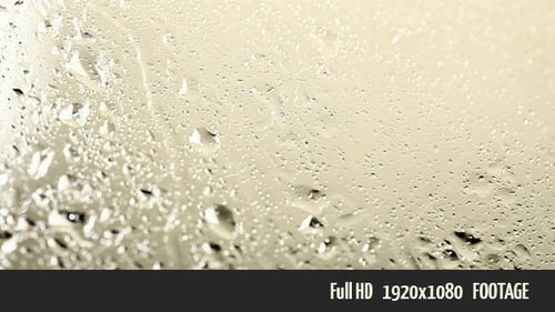 Rain Drops Flowing on Glass Surface