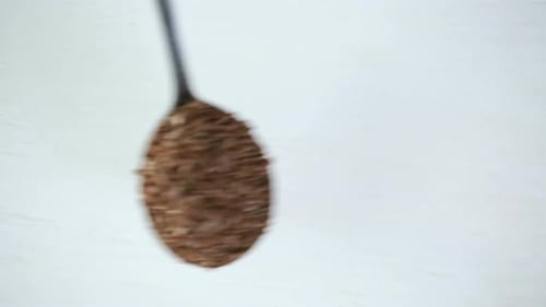 Spoons Filled With Nutritious Flax Seeds Close Up