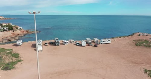 RV Park Campground at Coast. Ocean During Sunset. Aerial View.