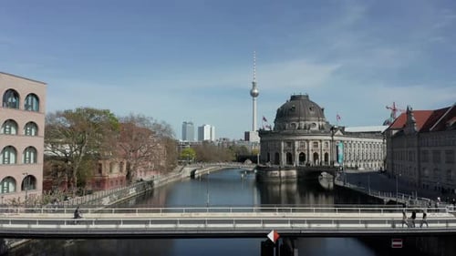 CIRCA MARCH 2020: AERIAL: Slow Flight Over Small Bridge Over Spree in Berlin, Germany with View on