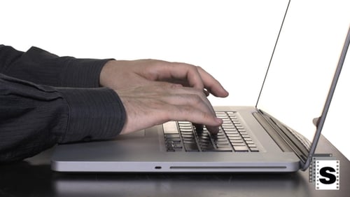 Hands Typing on Laptop at Desk