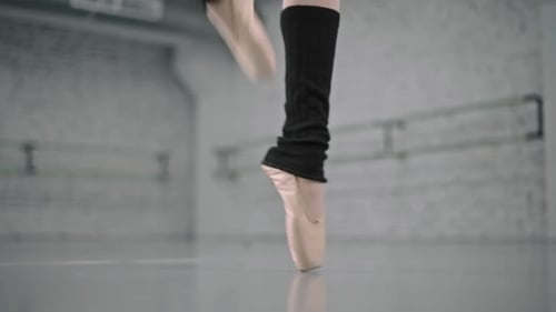 Ballet Dancer Practicing Pointe Technique in Dance Studio