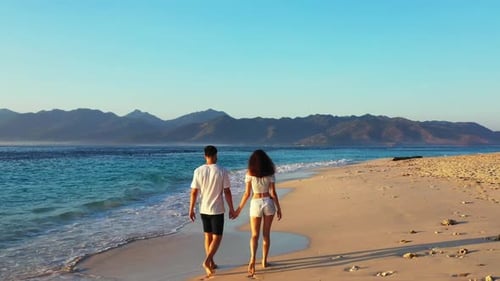 Boy and girl relax on tropical shore beach voyage by transparent sea and white sand background of Lo