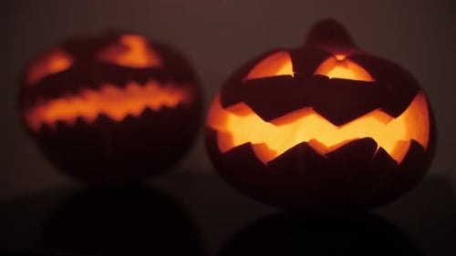 Two Glowing Jack-o'-Lanterns on Halloween