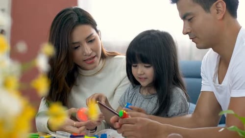 Family Creates Colorful Clay Sculpture Together Indoors