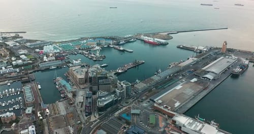 Wide Aerial Shot Tracking Forward Into the City of Cape Town During a Spectacular Sunset with Table