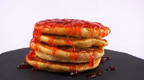 Pancakes Topped With Red Strawberry Jam Syrup