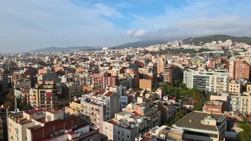 Aerial drone view of Barcelona, Spain. Blocks with multiple residential buildings, greenery
