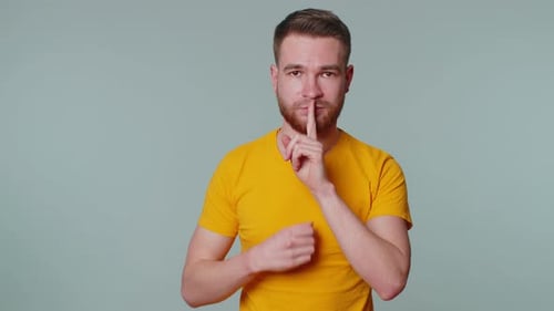 Man Presses Index Finger to Lips Makes Silence Gesture Sign Do Not Tells Secret Shh Be Quiet