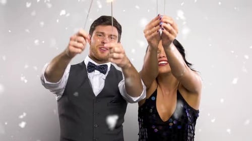 Happy Couple Celebrates with Sparklers and Laughter
