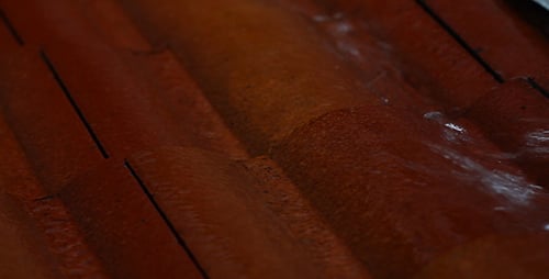 Water trickling over a rippled surface