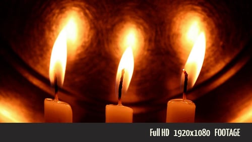 Three Candles Burning with Soft Orange Glow