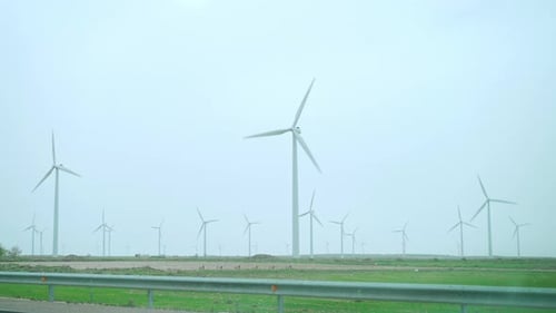 Large Wind Turbines with Blades in Field Blue Sky Wind Park