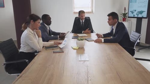 Business People in Meeting at Conference Table