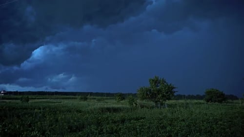 Dark Storm Clouds Over Rural Grassy Field