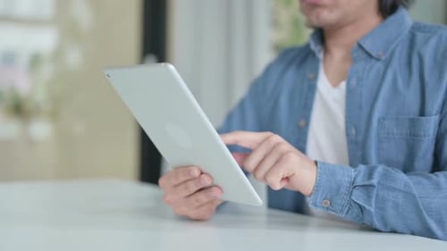 Close Up of Hand Working on Digital Tablet