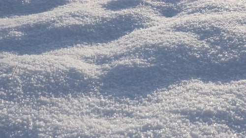 Frozen crystalline water snowflakes over the hill slow tilt 4K 3840X2160 UHD video - Sunrise over mo