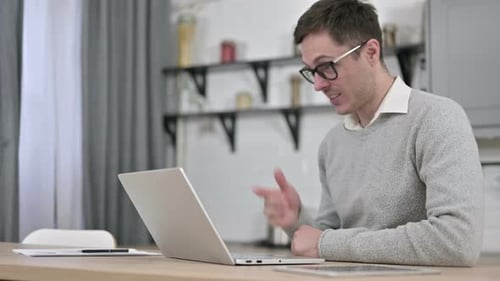 Young Adult On Video Call At Home