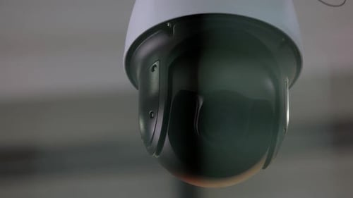 Closeup of Rotating Surveillance Security Video Camera