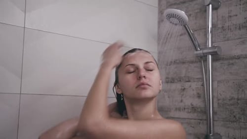 Woman Washing Her Hair in Shower