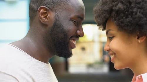 Loving Couple Touching Foreheads and Smiling