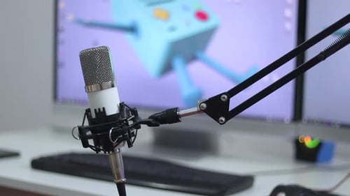 Microphone on a Stand with Computer in Background