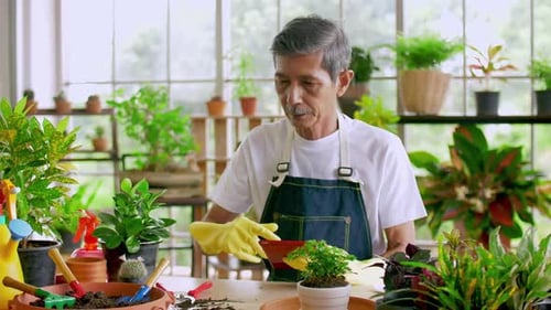Senior Man Gardening with Tablet at Home