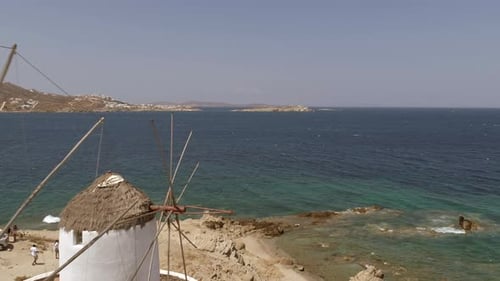 Aerial view of traditional windmill near the coast, Greece.