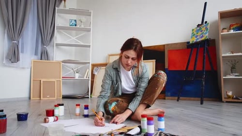 Young Woman Drawing in Bright Home Studio