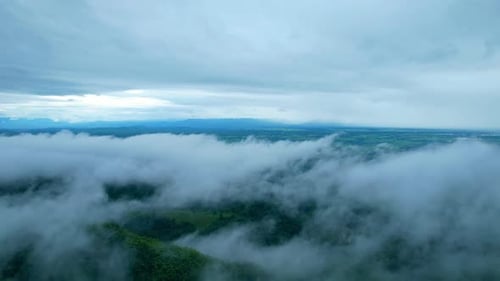4K Aerial Drone shot flying over beautiful mountain ridge in rural jungle bush forest.