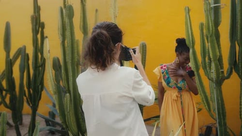 Female Photographer Taking Photos of Model