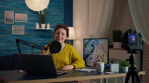 Woman Vlogging at Desk with Professional Microphone