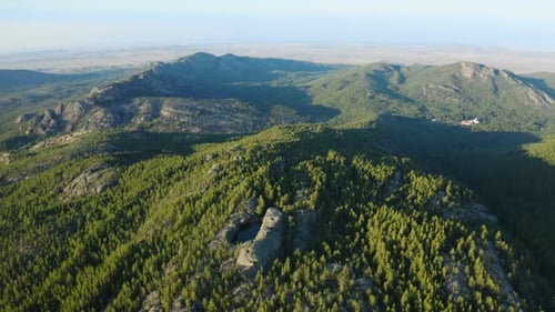 Breathtaking Aerial View of Mountain Range and Forest