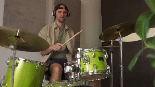 Man Records Drum Lesson Demonstrating Playing Drums