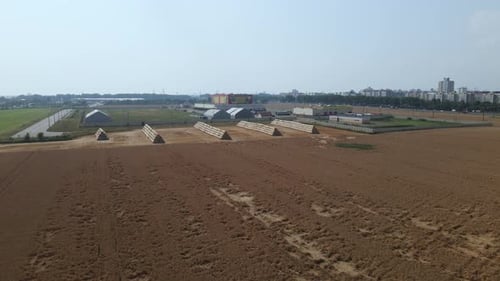 Part Of The Field Has Been Harvested With A Combine.