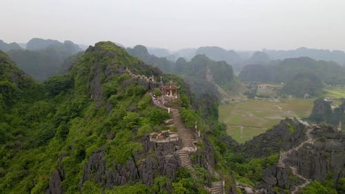 Aerial Shot of the Small Temple and a Dragon on the Top of Marble Mountain Mua Cave Mountain in Ninh