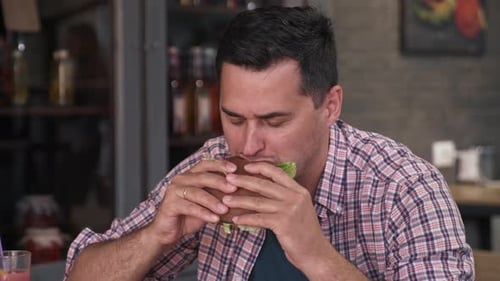 Restaurant Food, Portrait of Hungry Man Looking at Screen of Mobile Phone Puts Smartphone on Table