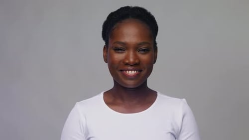 Smiling Woman Gives Double Thumbs Up Gesture