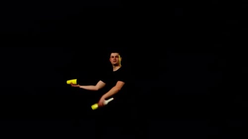 Man Performing Juggling Act with Yellow and White Objects