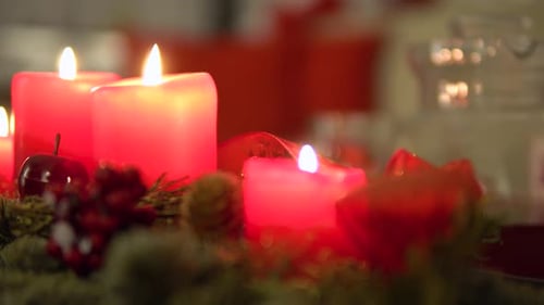 Christmas Candles Glowing in Festive Arrangement