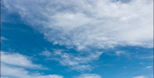 Blue Sky with Drifting White Clouds