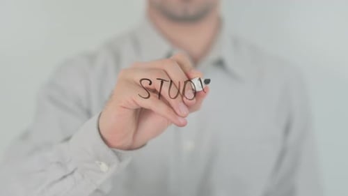Man Writes 'Study' with Black Marker