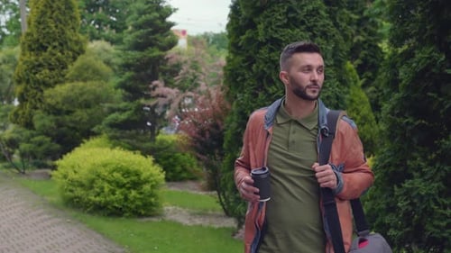 Handsome Stylish Guy Drinking Coffee on the Way To Work