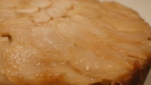 Slow pan over baked fruit cake on plate close-up texture 4K 2160p 30fps UltraHD footage - Apple pi