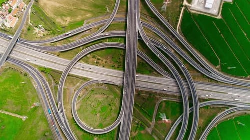 Freeway Road with Moving Cars Between Green Fields